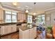 Gourmet kitchen with a center island, stainless appliances, and adjacent dining area at 20971 Shoreline Ct # 305, Noblesville, IN 46062