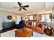 Open-concept living room with hardwood floors and seamless flow into the kitchen at 20971 Shoreline Ct # 305, Noblesville, IN 46062