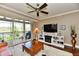 Cozy living room with sliding doors to the balcony and modern furnishings at 20971 Shoreline Ct # 305, Noblesville, IN 46062