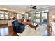 Open-concept living area with modern finishes, balcony, and hardwood floors at 20971 Shoreline Ct # 305, Noblesville, IN 46062