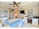 Bright bedroom with wood ceiling fan, carpet, and ample desk space at 20971 Shoreline Ct # 305, Noblesville, IN 46062
