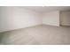 Spacious basement features neutral carpet, white walls, and ample room for activities, recreation, or storage at 210 Aster Way, Greenfield, IN 46140