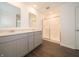 Modern bathroom featuring double sink vanity with quartz countertop and a glass-enclosed shower for a spa-like experience at 210 Aster Way, Greenfield, IN 46140