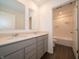 Modern bathroom featuring double vanity, stone countertop, tile floors and shower at 210 Aster Way, Greenfield, IN 46140