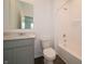 Bathroom featuring a modern vanity with a quartz countertop, sleek fixtures, and a shower-tub combo at 210 Aster Way, Greenfield, IN 46140