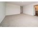 A bright bedroom with neutral carpet, white walls, and convenient access to the ensuite bathroom at 210 Aster Way, Greenfield, IN 46140