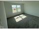 Empty bedroom with neutral carpet, a large window offering lots of natural light, and clean, white walls at 210 Aster Way, Greenfield, IN 46140