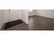 Clean, modern entryway featuring sleek, dark-toned floors and a welcoming white door at 210 Aster Way, Greenfield, IN 46140