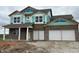 Under construction two-story brick home featuring an attached two car garage and covered porch at 210 Aster Way, Greenfield, IN 46140