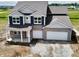 An aerial view of an elegant two-story home with a two-car garage at 210 Aster Way, Greenfield, IN 46140
