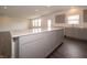 Bright kitchen featuring large center island, gray cabinetry, and recessed lighting at 210 Aster Way, Greenfield, IN 46140