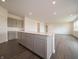 Modern kitchen showcasing island, gray cabinetry and stainless appliances at 210 Aster Way, Greenfield, IN 46140