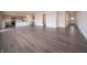 Bright and spacious living area showcasing elegant dark-toned floors and a modern, open-concept layout at 210 Aster Way, Greenfield, IN 46140