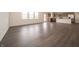 Open concept living area featuring dark-toned floors, a modern kitchen and abundant natural light at 210 Aster Way, Greenfield, IN 46140