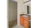 Bathroom featuring a vanity and a doorway that leads into a walk-in closet at 2138 Rossington Ln, Indianapolis, IN 46229