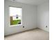 Simple bedroom featuring carpeted floors, a neutral color palette, and a window for natural light at 2138 Rossington Ln, Indianapolis, IN 46229