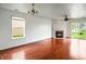 Bright living room featuring hardwood floors, fireplace and sliding glass doors at 2138 Rossington Ln, Indianapolis, IN 46229