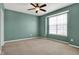 Bedroom featuring blue walls, neutral carpeting, and a window with natural lighting at 2270 Brightwell Pl, Indianapolis, IN 46260