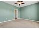 Bedroom with green walls, neutral carpeting, a ceiling fan, and natural light at 2270 Brightwell Pl, Indianapolis, IN 46260