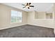 Spacious bedroom features a ceiling fan, large window with blinds, and neutral-toned walls at 2270 Brightwell Pl, Indianapolis, IN 46260