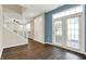 Open entryway with a staircase, hardwood floors, and a view of the backyard through French doors at 2270 Brightwell Pl, Indianapolis, IN 46260