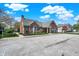 Clubhouse exterior features a parking lot and landscaping at 2270 Brightwell Pl, Indianapolis, IN 46260