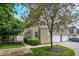 Charming townhome featuring vinyl siding, attached garage, and well-maintained landscaping at 2270 Brightwell Pl, Indianapolis, IN 46260
