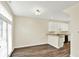 Open-concept space with wood floors, white cabinets, and a stainless steel dishwasher at 2270 Brightwell Pl, Indianapolis, IN 46260
