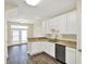 Bright kitchen with double sink, dishwasher, and an open layout to the dining area at 2270 Brightwell Pl, Indianapolis, IN 46260