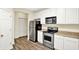 Well-lit kitchen with stainless steel appliances, sleek cabinetry, and durable countertops at 2270 Brightwell Pl, Indianapolis, IN 46260