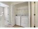 Upstairs laundry closet featuring a washer and dryer, optimizing space at 2270 Brightwell Pl, Indianapolis, IN 46260