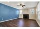 Inviting living room with a fireplace, large windows and modern dark floors at 2270 Brightwell Pl, Indianapolis, IN 46260