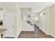 Open-concept living area featuring wood floors, staircase, and access to other living spaces at 2270 Brightwell Pl, Indianapolis, IN 46260