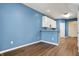 Modern area boasting stylish flooring, pristine white cabinetry, and contemporary blue walls at 2270 Brightwell Pl, Indianapolis, IN 46260