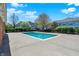 Community pool with surrounding deck, mature trees and lush landscaping at 2270 Brightwell Pl, Indianapolis, IN 46260