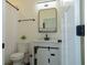 Modern bathroom featuring a sleek vanity with undermount sink, white walls, and a toilet at 2302 Prospect St, Indianapolis, IN 46203