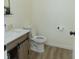 Modern bathroom with a vanity, toilet, and neutral wall colors at 2302 Prospect St, Indianapolis, IN 46203