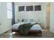 Well-lit bedroom with a bed, fresh linens, and simple bedside decor at 2302 Prospect St, Indianapolis, IN 46203