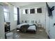 Bright bedroom featuring a comfortable bed, fresh linens, and sleek modern furnishings at 2302 Prospect St, Indianapolis, IN 46203