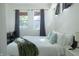 Comfortable bedroom featuring a plush bed with fresh linens and ample natural light at 2302 Prospect St, Indianapolis, IN 46203