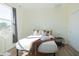 Bright bedroom with a queen bed, hardwood floors, and a large window at 2302 Prospect St, Indianapolis, IN 46203