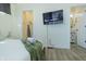 Cozy bedroom featuring a TV, closet, and a bathroom at 2302 Prospect St, Indianapolis, IN 46203