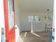 Bright entryway with red door and access to the upper level and modern living spaces at 2302 Prospect St, Indianapolis, IN 46203