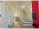 Bright entryway showcasing a staircase, light-colored flooring, and an open view into the living area at 2302 Prospect St, Indianapolis, IN 46203