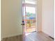 Bright entryway featuring a red door leading to a wooden deck with a view of a neighboring house at 2302 Prospect St, Indianapolis, IN 46203