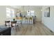 Bright, modern kitchen featuring stainless steel appliances, an island with seating and an adjacent dining area at 2302 Prospect St, Indianapolis, IN 46203