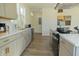 A view of a modern kitchen with quartz countertops, stainless steel appliances, and stylish gold hardware at 2302 Prospect St, Indianapolis, IN 46203