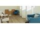 Bright living area with stylish seating, fan, and neutral walls for a welcoming space at 2302 Prospect St, Indianapolis, IN 46203