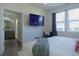Comfortable bedroom featuring modern décor, neutral wall colors, and en-suite bathroom at 2302 Prospect St, Indianapolis, IN 46203