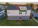 Aerial shot of the back exterior with a modern design, a small deck, and a gray and white color scheme at 2302 Prospect St, Indianapolis, IN 46203